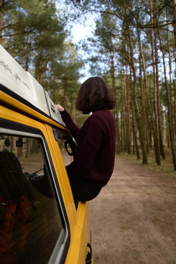 Woman Sitting On The Car's Window